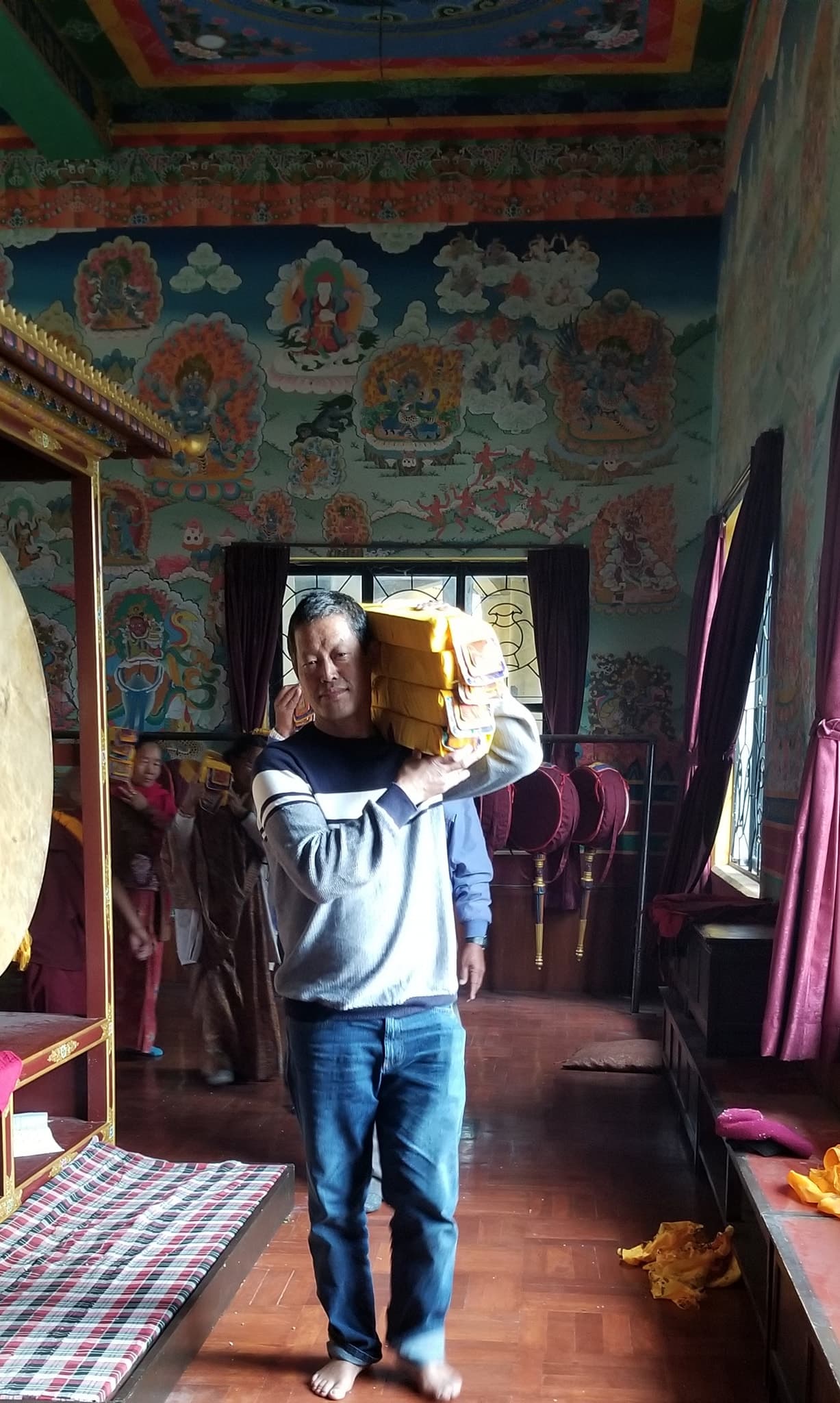 A Man Carrying Holy Buddhist Scriptures