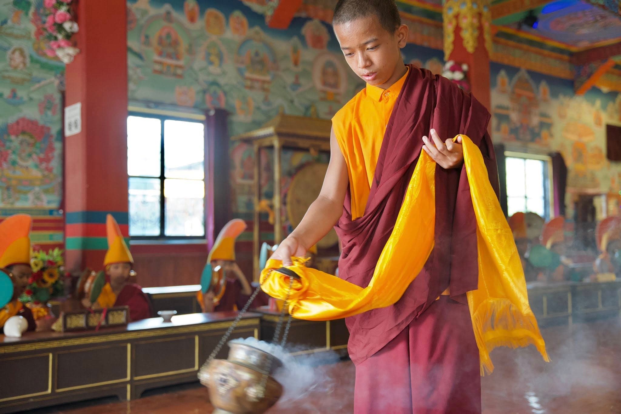 Monk Holding Incense Burner